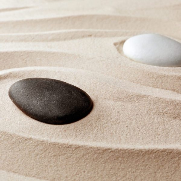Zen Garden Stones On Sand With Pattern. Meditation And Harmony